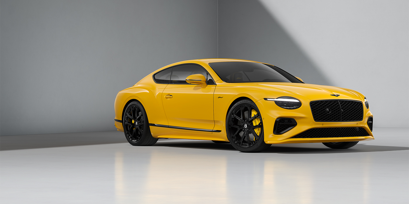 Bentley Düsseldorf Bentley Continental GT Speed coupe in Monaco Yellow paint and 22" Ten spoke sport wheels - front 3/4