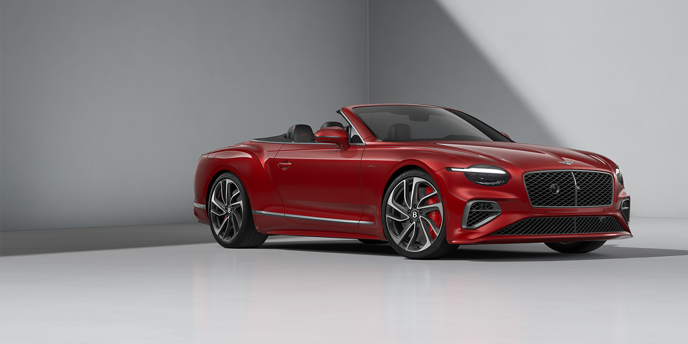 Bentley Düsseldorf Bentley Continental GTC Speed convertible in Dragon Red paint and 22" swept spoke wheels - front 3/4
