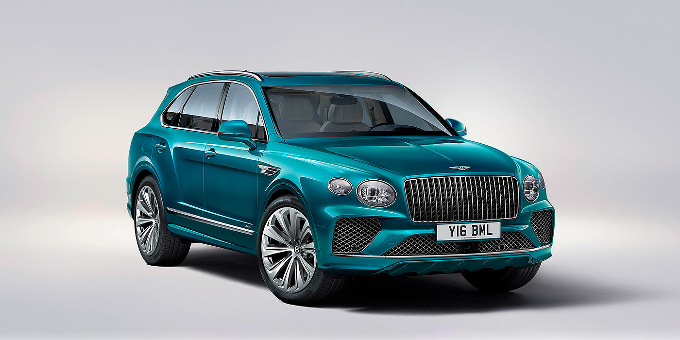 Bentley Düsseldorf Bentley Bentayga Azure front three-quarter view, featuring a fluted chrome grille with a matrix lower grille and chrome accents in Topaz blue paint.