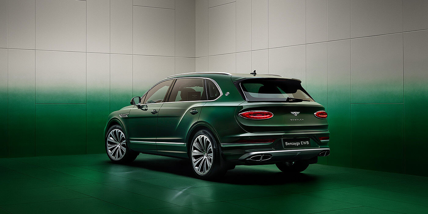 Bentley Düsseldorf Bentley Bentayga Extended Wheelbase SUV Rear three quarter view in Light Emerald green paint in green and grey room