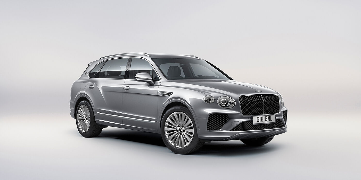 Bentley Düsseldorf Bentley Bentayga Extended Wheelbase luxury SUV front three quarter view in Moonbeam paint with 21 inch five spoke painted wheels