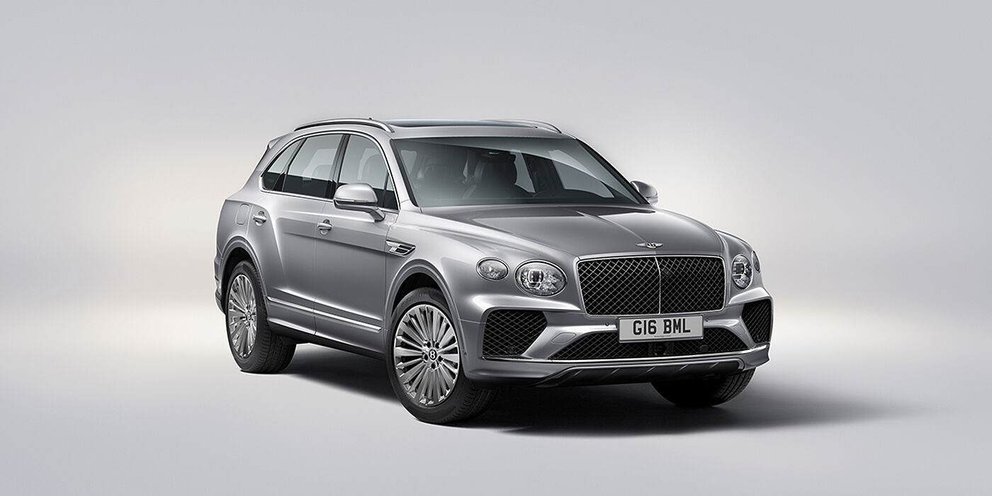Bentley Düsseldorf Bentley Bentayga luxury SUV front three quarter view in Moonbeam paint with matrix grille and 21″ 5 spoke painted wheels