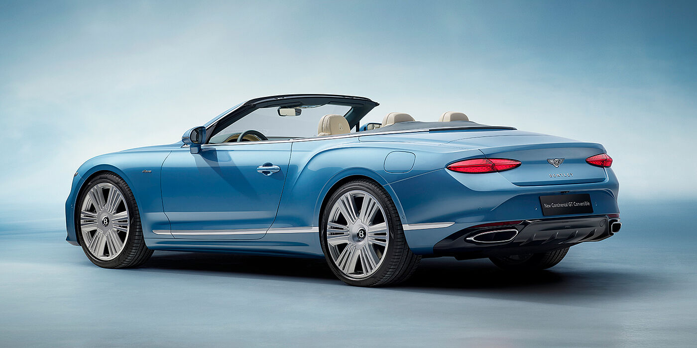 Bentley Düsseldorf New Bentley Continental GTC Azure convertible rear view in Light Windsor blue paint with 22 inch ten spoke wheels and chrome exterior details