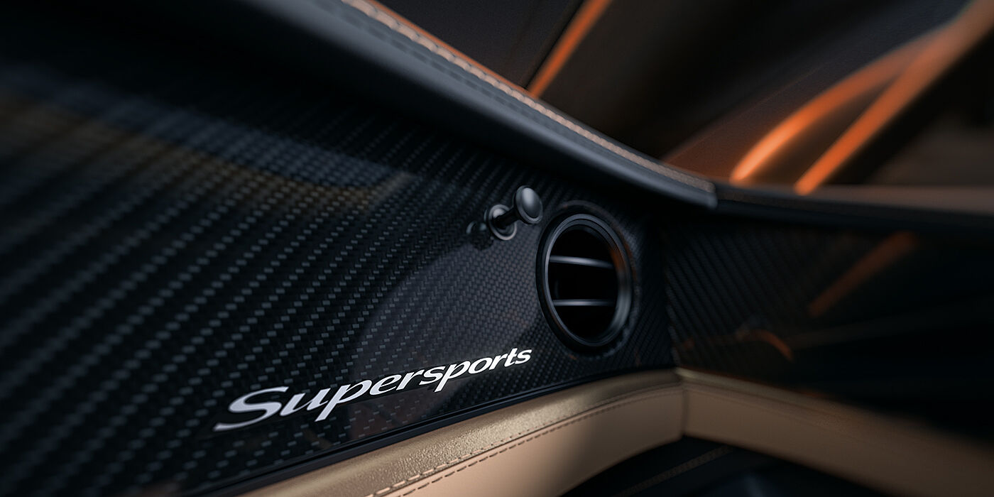 Bentley Düsseldorf Bentley Supersports front interior high gloss black carbon fibre veneer detail with Supersports badge