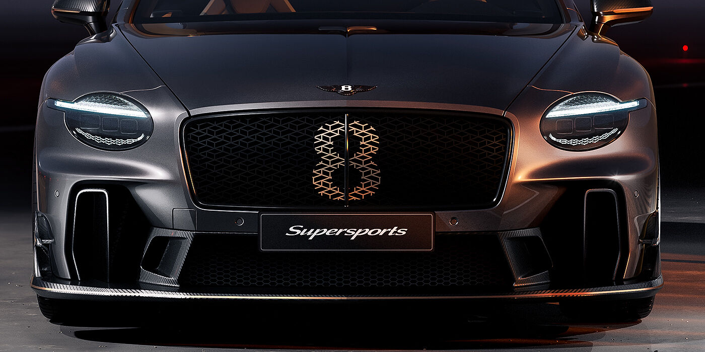 Bentley Düsseldorf Bentley Supersports front exterior with illuminated head lamps and Supersports grille in Anthracite paint