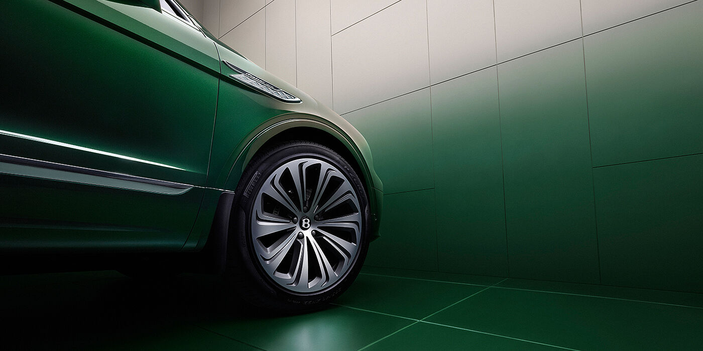 Bentley Düsseldorf Bentley Bentayga Atelier Edition SUV in Light Emerald green paint front side detail with 22 inch 10 spoke wheel