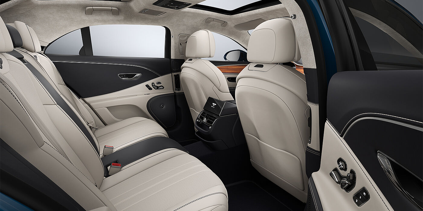 Bentley Düsseldorf New Bentley Flying Spur sedan rear interior in Linen and Imperial Blue hides with Open Pore Koa veneer