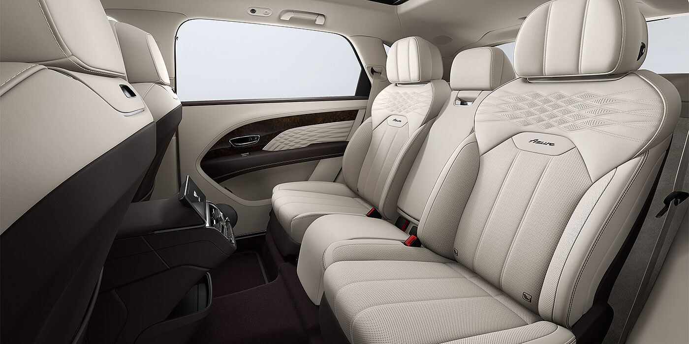 Bentley Düsseldorf Bentley Bentayga EWB Azure SUV rear interior in Linen and Burnt Oak hides and Azure seat stitching
