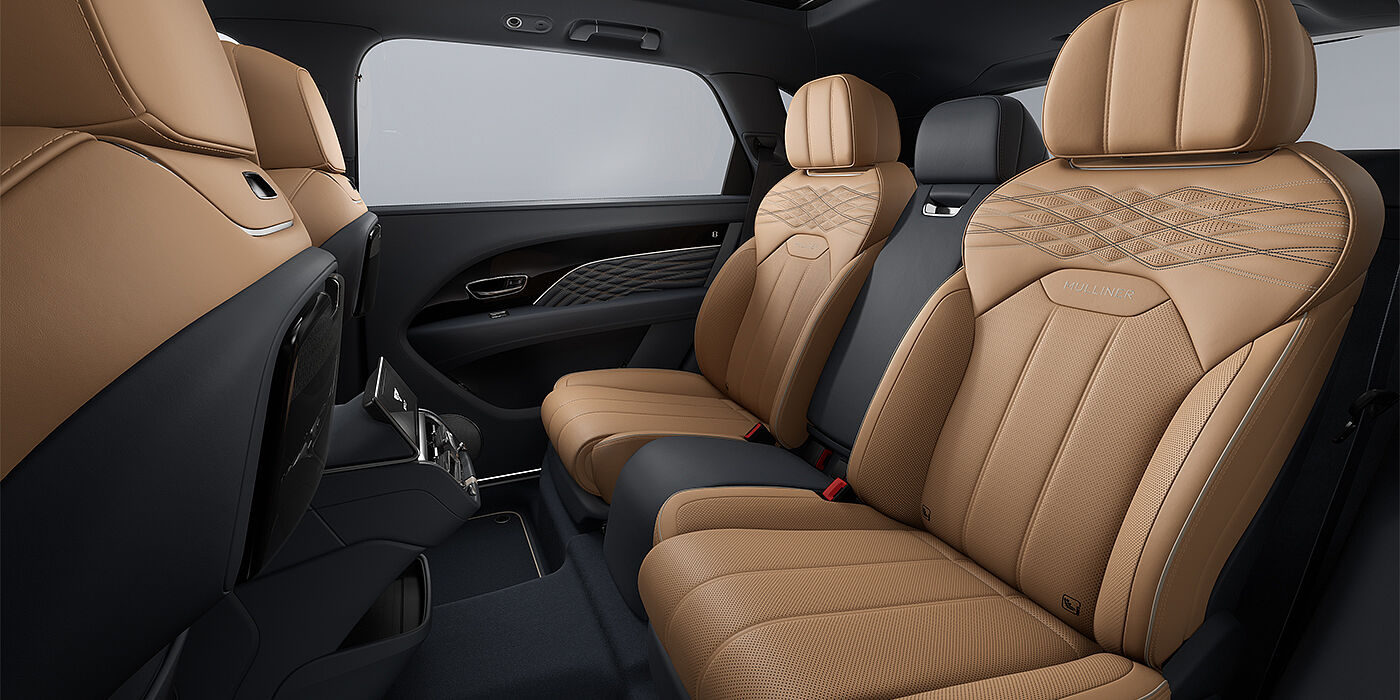 Bentley Düsseldorf Bentley Bentayga EWB Mulliner SUV rear interior in Camel and Brunel hides with Mulliner contrast stitching