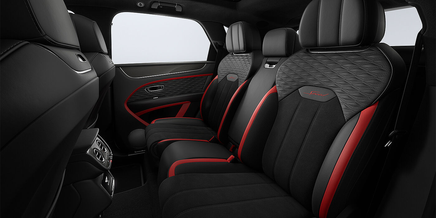 Bentley Düsseldorf Bentley Bentayga Speed SUV rear interior in Pillar Box Red and Beluga black hides and Speed seat stitching