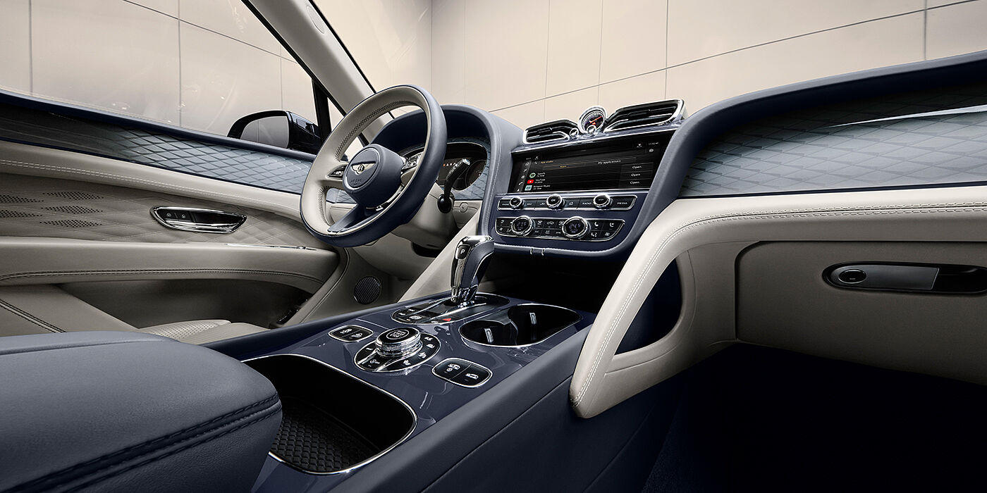 Bentley Düsseldorf Bentley Bentayga Atelier Edition SUV front interior in Linen and Imperial Blue hides with Dark Tint Diamond Brushed Aluminium veneer