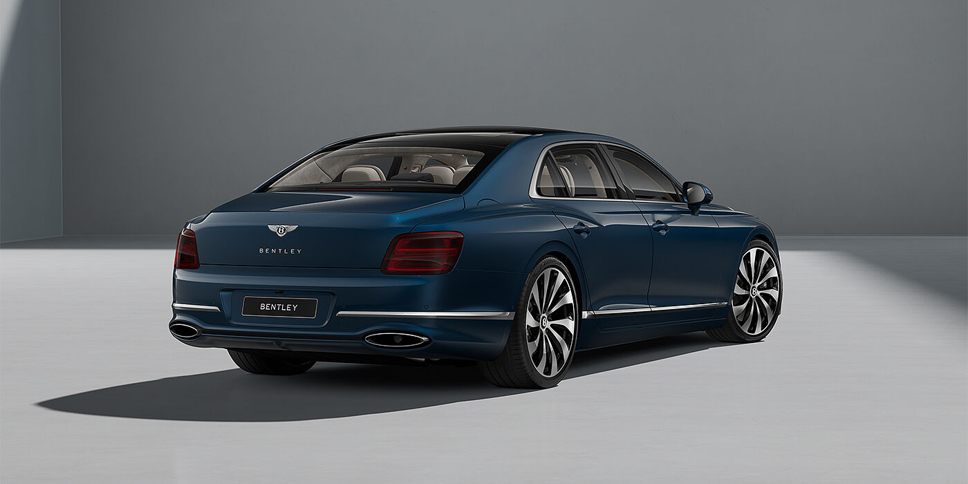 Bentley Düsseldorf New Bentley Flying Spur sedan in Marlin blue paint rear 3/4 with 22" Ten Spoke Black Painted and Bright Machined wheels