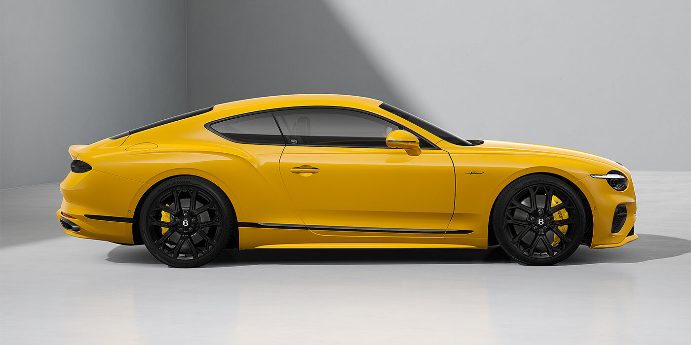 Bentley Düsseldorf Bentley Continental GT Speed coupe in Monaco Yellow paint and 22" Ten spoke sport wheels - profile