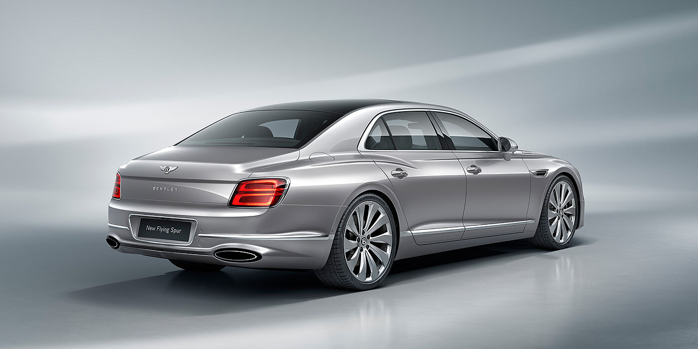 Bentley Düsseldorf New Bentley Flying Spur sedan rear view in Silverlake paint with ten spoke wheels and chrome matrix grille
