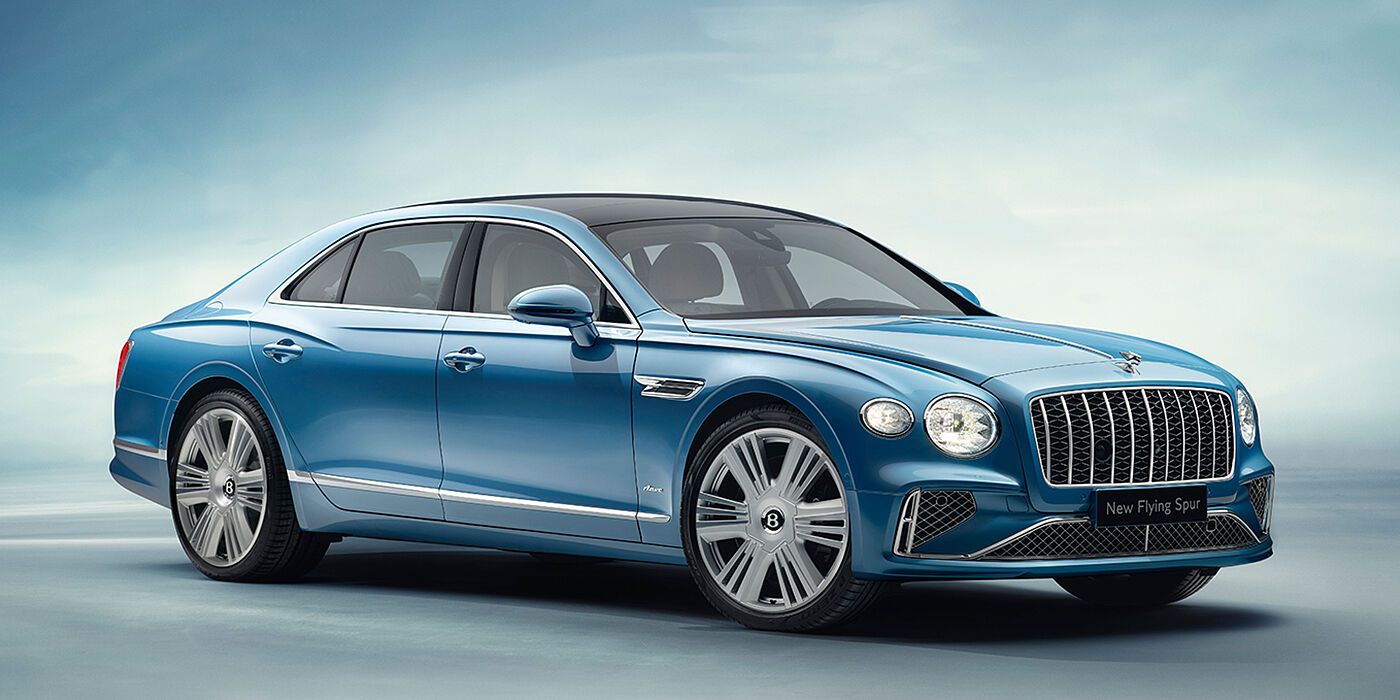 Bentley Düsseldorf New Bentley Flying Spur Azure sedan front view in Light windsor blue by Mulliner paint with 22 inch Azure wheels and chrome exterior details