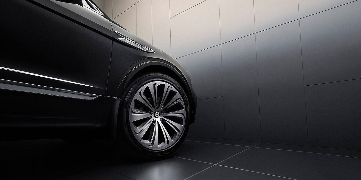 Bentley Düsseldorf Bentley Bentayga Atelier Edition SUV in Onyx black paint front side detail with 22 inch 10 spoke wheel