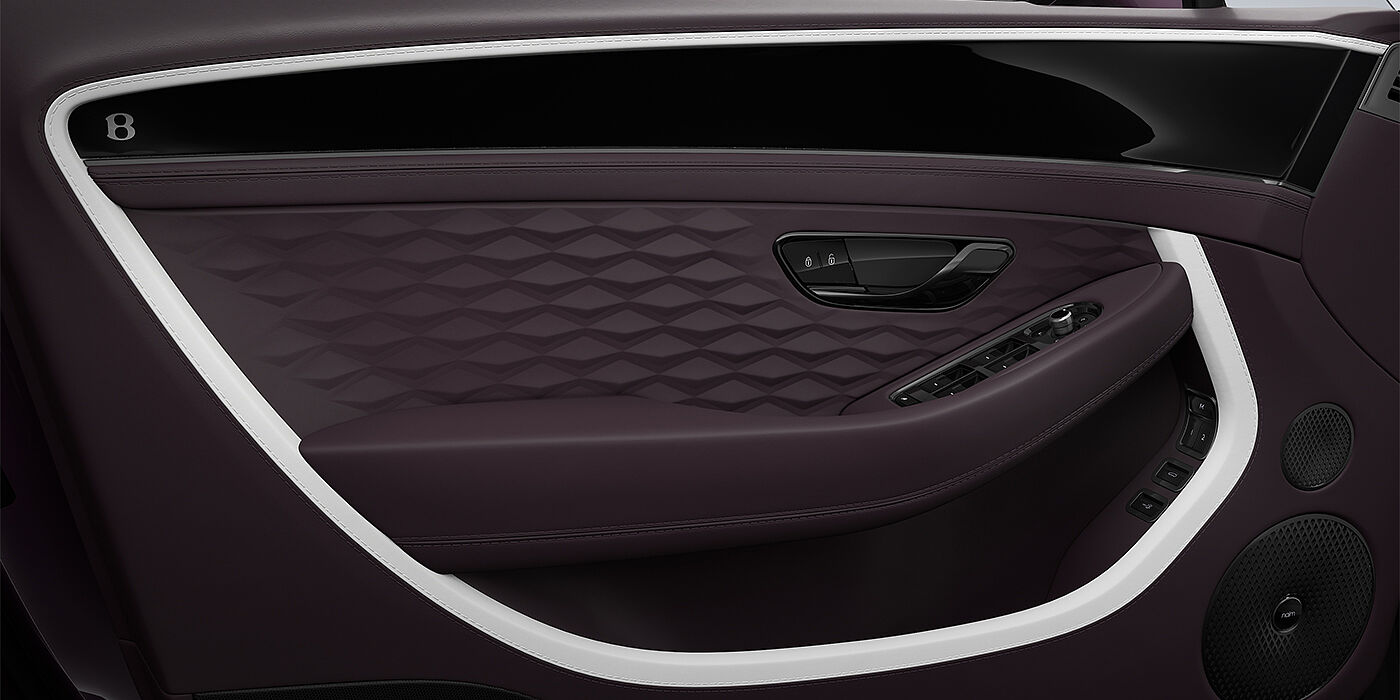 Bentley Düsseldorf Bentley Continental GT Mulliner coupe door detail in Beluga black and Damson hides with white accent hide