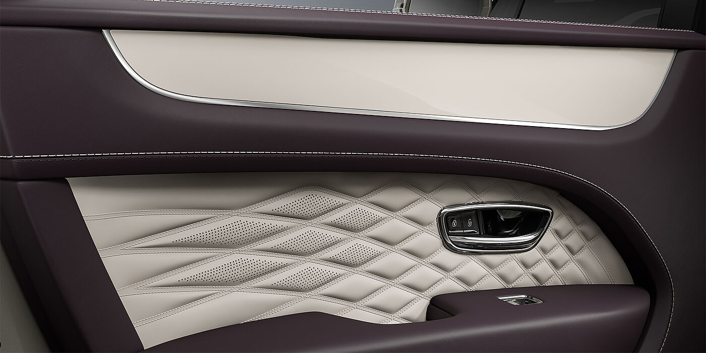 Bentley Düsseldorf Bentley Bentayga EWB Azure SUV door interior detail in Linen and Damson hides with Piano Linen veneer