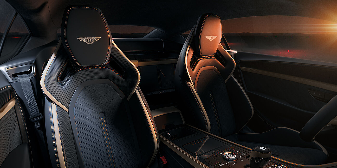 Bentley Düsseldorf Bentley Supersports rear interior with Supersports seats in Camel and Beluga black hides hide and high gloss carbon fibre veneer