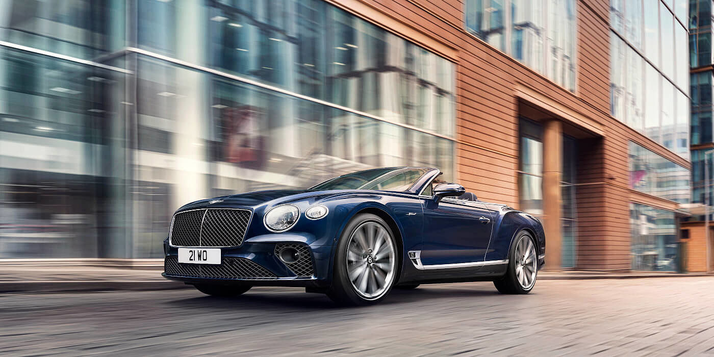 <new-bentley-continental-gt-speed-convertible-in-peacock-blue-paint-driving-in-manchester> 