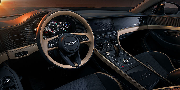 Bentley Düsseldorf Bentley Supersports front interior in Beluga and Camel hides with Bronze accents and high gloss black carbon fibre veneer.