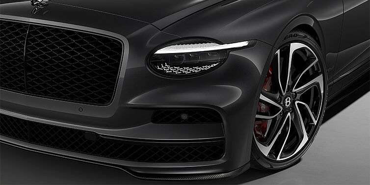 Bentley Düsseldorf New Bentley Flying Spur Speed sedan head lamp against Magnetic paint with  22" Swept spoke Black & Machined wheel