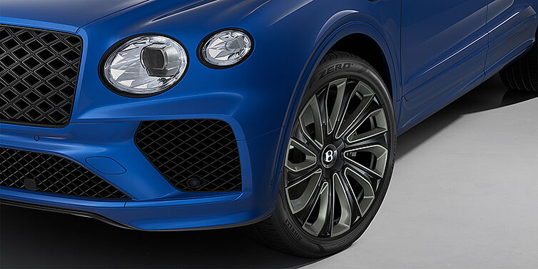 Bentley Düsseldorf Bentley Bentayga Artenara Edition SUV front detail in Sequin Blue paint and 22" Mulliner Gloss Black wheels front 3/4