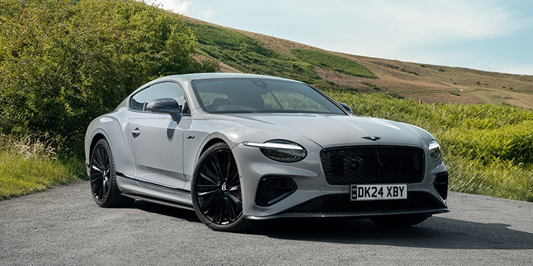 Bentley Düsseldorf Bentley Continental GT front three quarter with Carbon Fibre Specification parked on road.