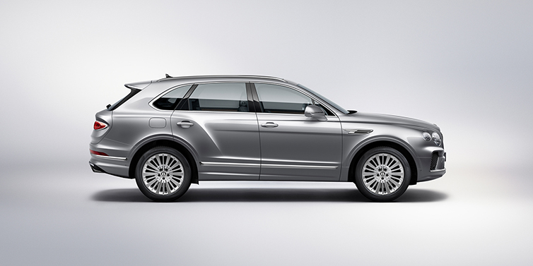 Bentley Düsseldorf Bentley Bentayga SUV side profile in Moonbeam silver paint against white background featuring 21 inch 5 spoke wheels