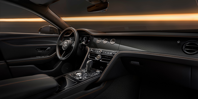 Bentley Düsseldorf Bentley Flying Spur Black Edition sedan front interior in Beluga black hide with High Gloss Carbon Fibre veneer