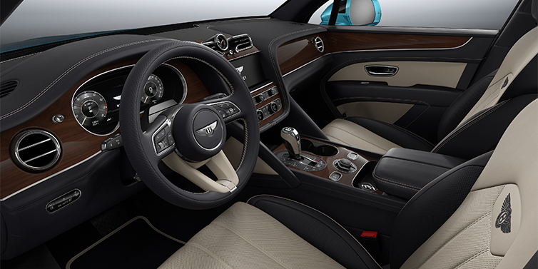 Bentley Düsseldorf Bentley Bentayga EWB SUV front interior in Portland and Imperial Blue hides with Crown Cut Walnut veneer