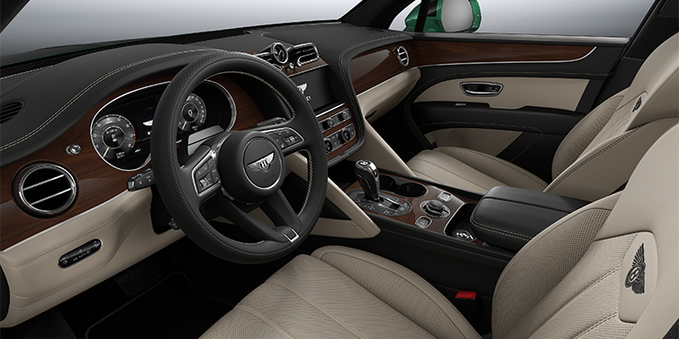 Bentley Düsseldorf Bentley Bentayga SUV front interior in Portland and Beluga black hides with Crown Cut Walnut veneer