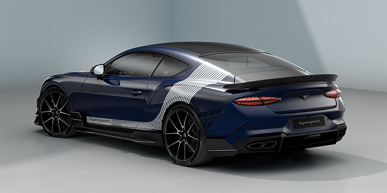 Bentley Düsseldorf Bentley Supersports rear three quarter in "Skies" Design theme with Electric Blue paint finish and Arctica white and Oxford blue paint stripes across the rear haunch.