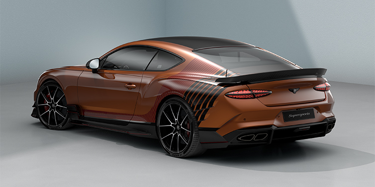 Bentley Düsseldorf Bentley Supersports rear three quarter in "Meteorite" Design theme with Orange Flame paint and Beluga Black and Candy Red paint stripes across the rear haunch.