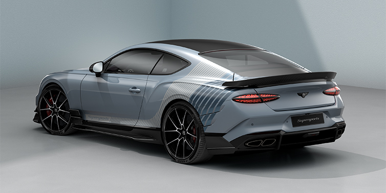 Bentley Düsseldorf Bentley Supersports rear three quarter in "Daybreak" Design theme with Jetstream blue paint and Arctica white and Portofino blue paint stripes across the rear haunch.
