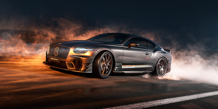 Bentley Düsseldorf Bentley Supersports front three quarter in "Nightfall" Design theme with Anthracite paint, Camel accents and Camel and Beluga black striping standing on mist covered concrete