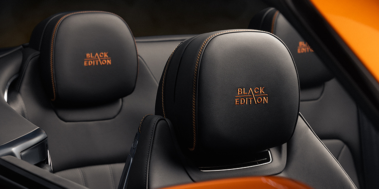 Bentley Düsseldorf Bentley Continental GTC Black Edition convertible seat detail with Beluga black hide and Mandarin emblem stitching